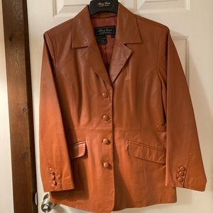 Terry Lewis Classic Luxuries terra cotta colored leather jacket